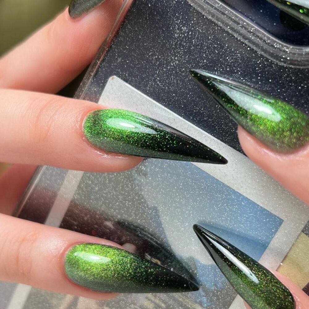 green cat eye stiletto nails